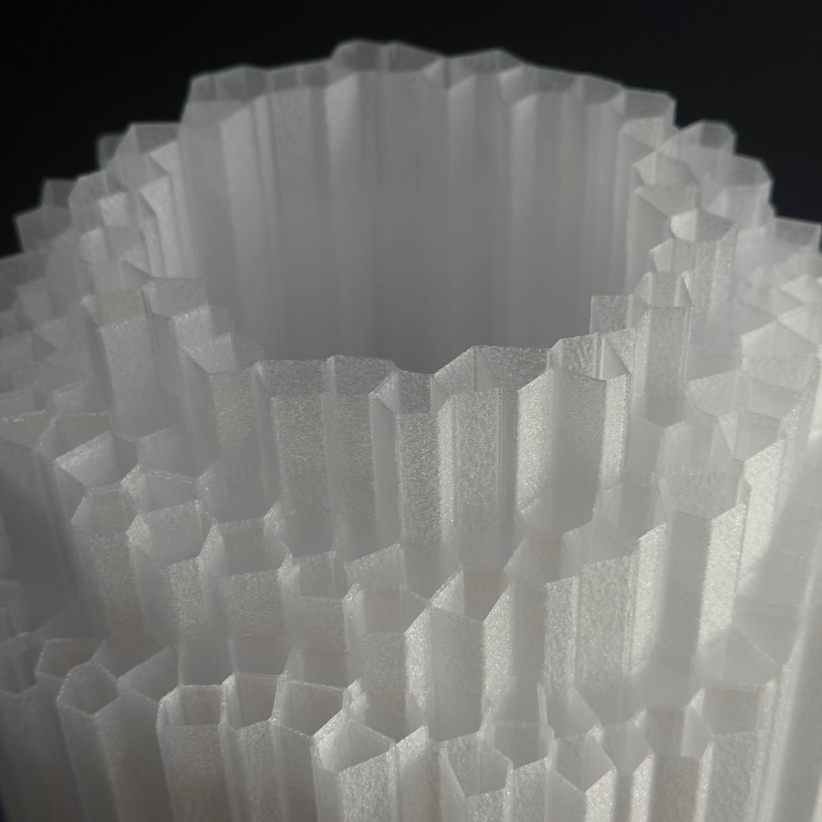 Macro of the crystalline top rim, showing the printed layer texture across each facet